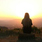 woman looking at sunset