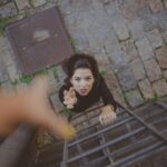 high angle photo of woman on ladder