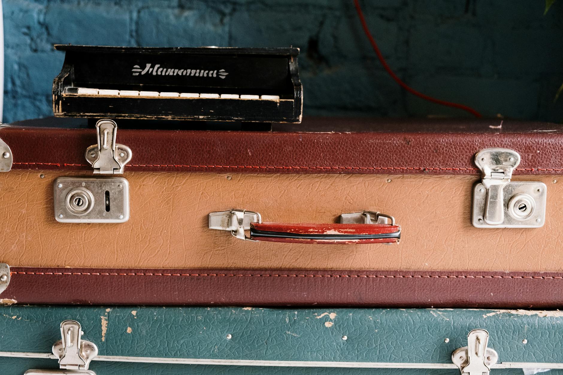 stacks of suitcases in close up photography